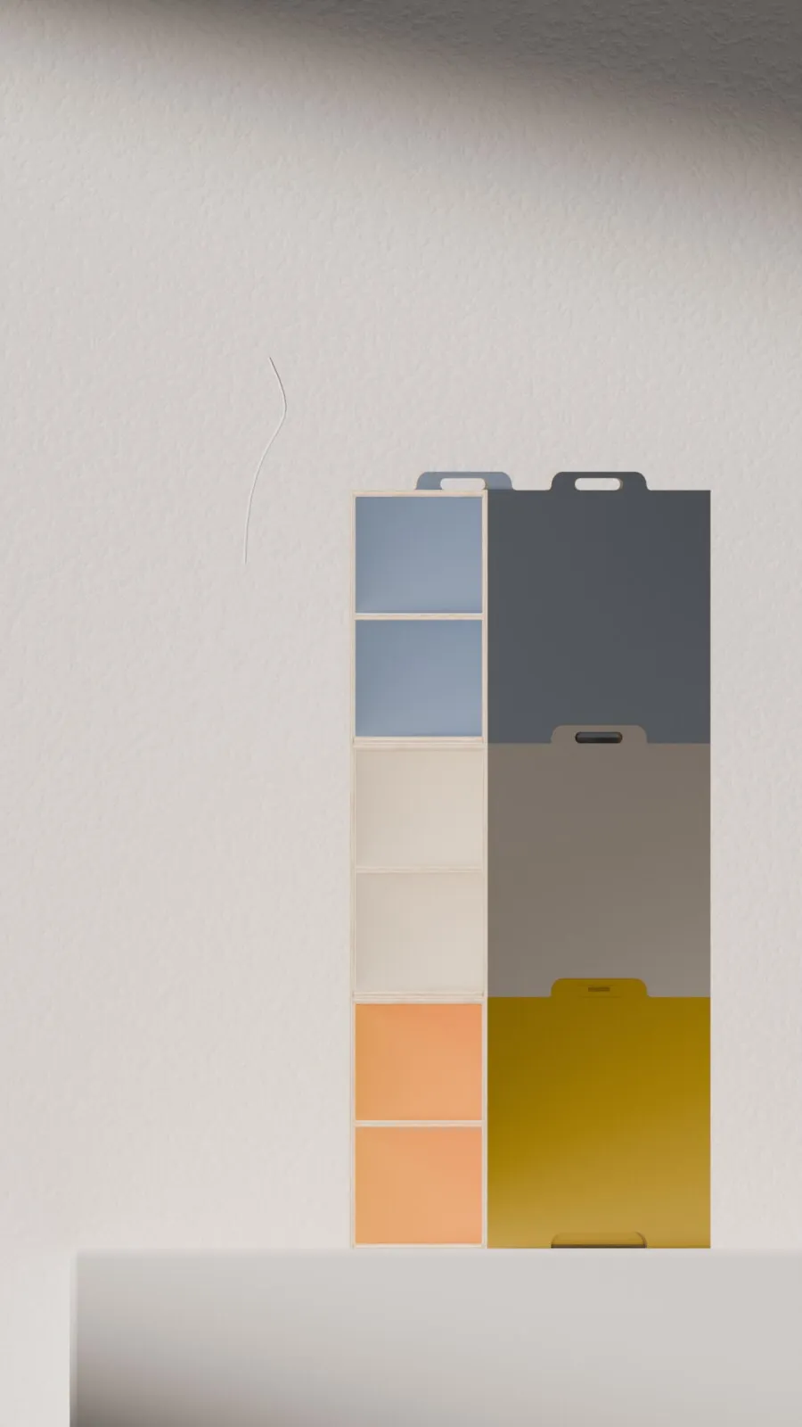 STAAPL-render: stapel in blauwgrijs, zand, oranje en mosterd tegen een witte wand